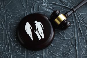 gavel and pad with a cutout image of a mom, dad, and child